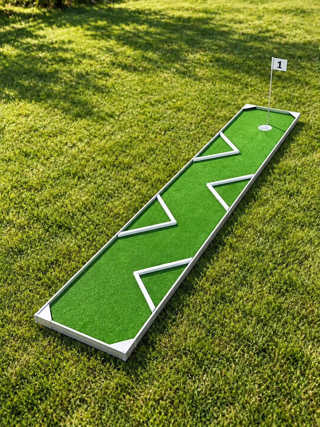 Concept image of a single portable mini golf putting lane on grass at a backyard party in Hamilton