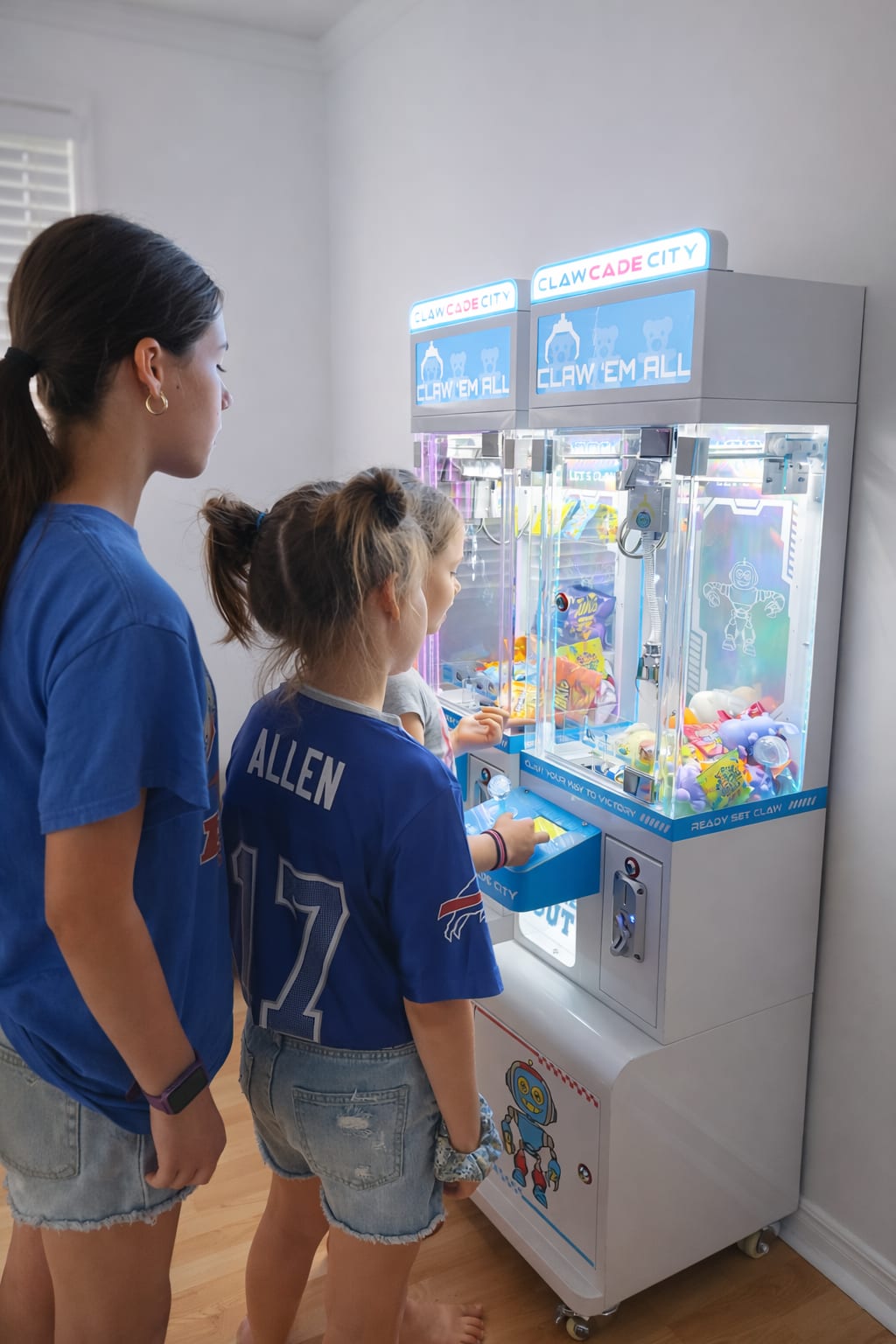 Kids playing claw machine at birthday party Hamilton